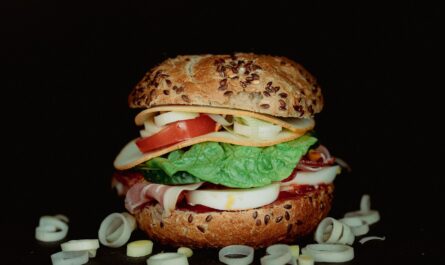 a sandwich with lettuce, tomato, and cheese