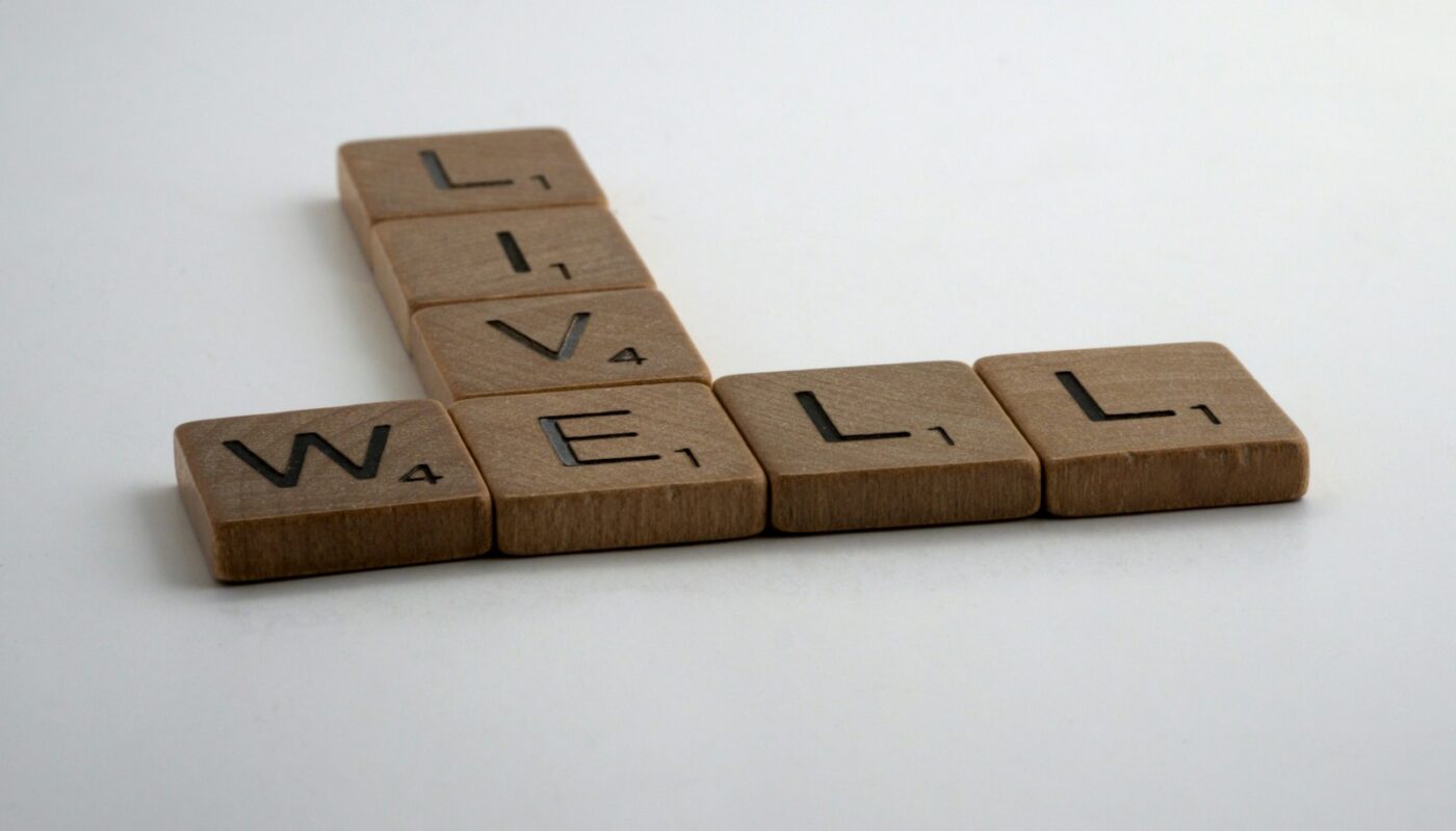 brown wooden letter blocks on white surface