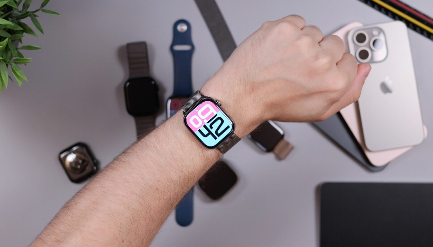 Person wearing smartwatch with iphones and bands